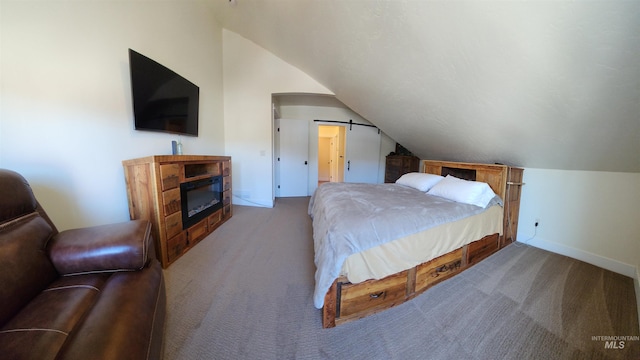 bedroom with vaulted ceiling and carpet