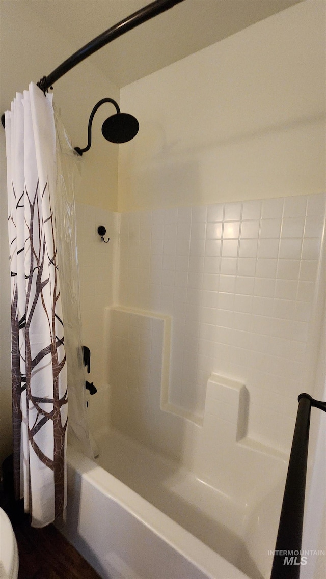 bathroom featuring shower / bath combination with curtain