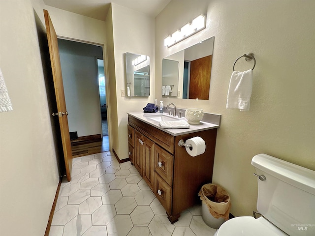 600 N 9th E, Mountain Home, ID 83647 - bathroom with vanity, toilet, and tile patterned floors