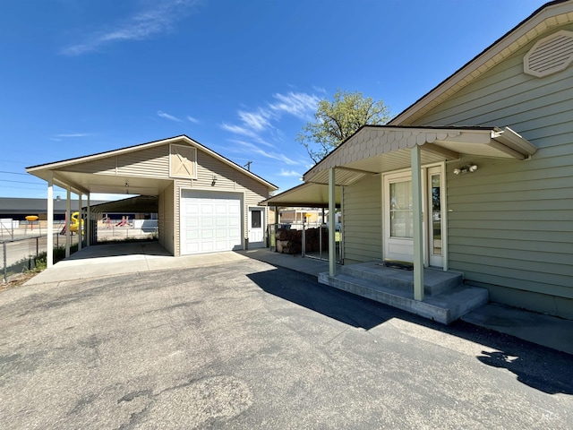 600 N 9th E, Mountain Home, ID 83647 - view of property exterior featuring an outdoor structure, driveway, and a garage