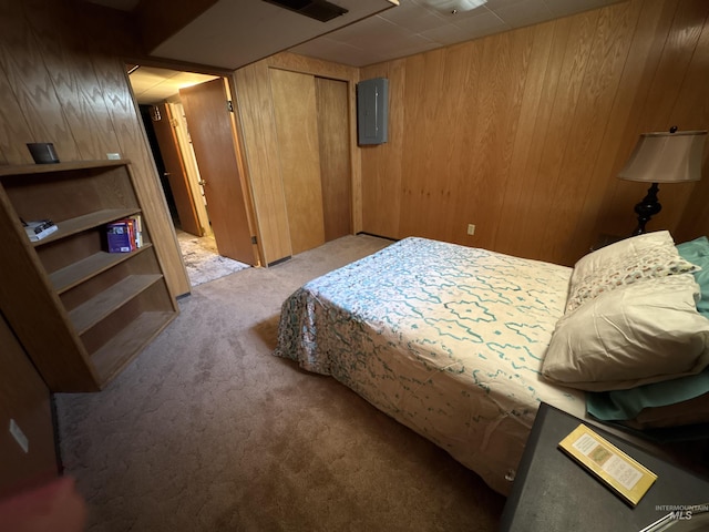 600 N 9th E, Mountain Home, ID 83647 - bedroom featuring wooden walls, carpet floors, and electric panel