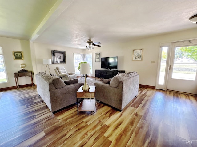 600 N 9th E, Mountain Home, ID 83647 - living room with light wood-type flooring, baseboards, and a ceiling fan