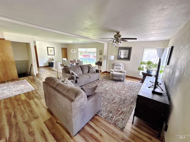 600 N 9th E, Mountain Home, ID 83647 - living area featuring wood finished floors, plenty of natural light, and ceiling fan