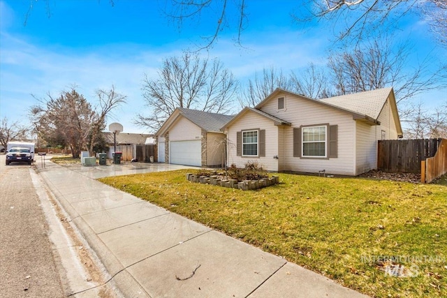 single story home with driveway, a front lawn, an attached garage, and fence