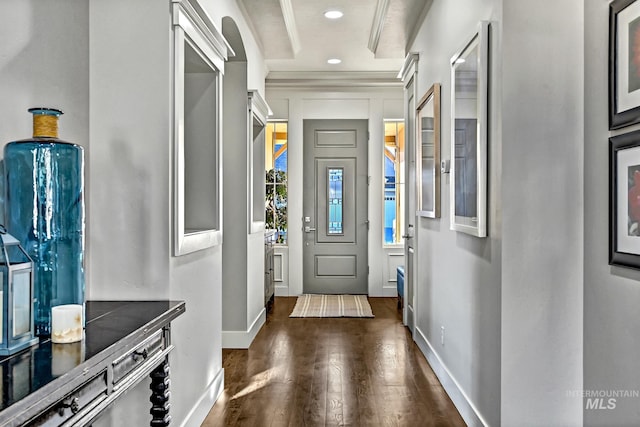 interior space featuring dark wood-type flooring and crown molding