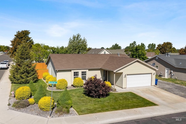 1590 Saddler St, Twin Falls, ID 83301 - view of front of house with an attached garage, a front lawn, concrete driveway, and roof with shingles