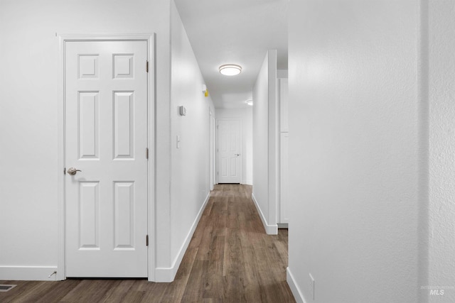 1590 Saddler St, Twin Falls, ID 83301 - hall with baseboards and dark wood-style floors
