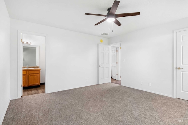 1590 Saddler St, Twin Falls, ID 83301 - unfurnished bedroom with carpet flooring, baseboards, a sink, connected bathroom, and a ceiling fan