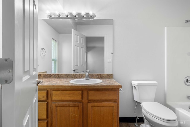 1590 Saddler St, Twin Falls, ID 83301 - bathroom with vanity, toilet, and washtub / shower combination