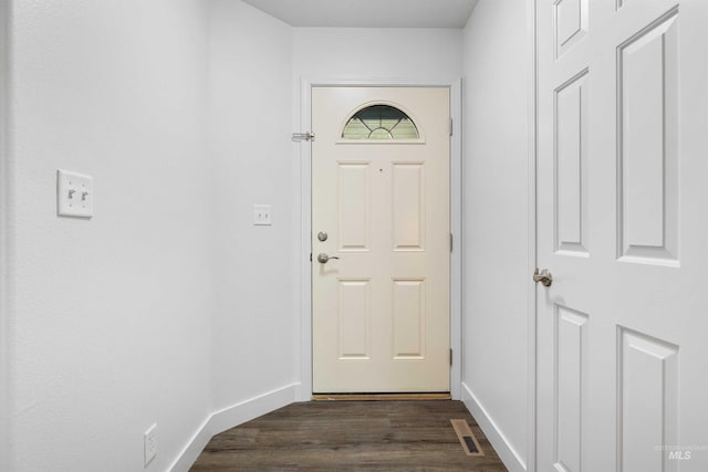 1590 Saddler St, Twin Falls, ID 83301 - doorway to outside featuring dark wood-type flooring and baseboards