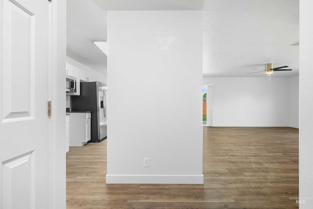 1590 Saddler St, Twin Falls, ID 83301 - unfurnished room featuring ceiling fan, wood finished floors, and baseboards