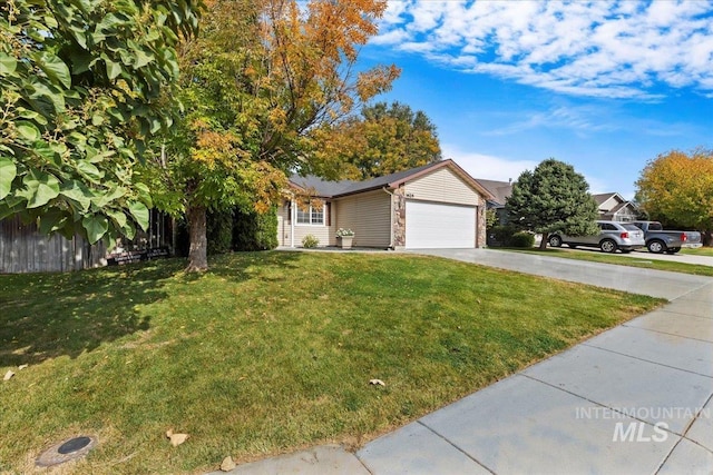 view of front of property with a front yard and a garage