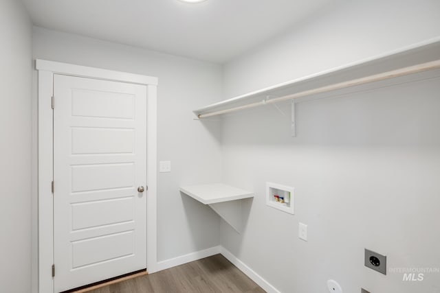 laundry room featuring washer hookup, hookup for an electric dryer, wood finished floors, laundry area, and baseboards