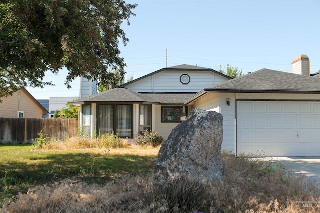 1396 W Crest Wood Dr, Meridian, ID 83642 - ranch-style home featuring roof with shingles, an attached garage, a sunroom, a chimney, and driveway