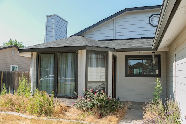 1396 W Crest Wood Dr, Meridian, ID 83642 - doorway to property with roof with shingles and a chimney