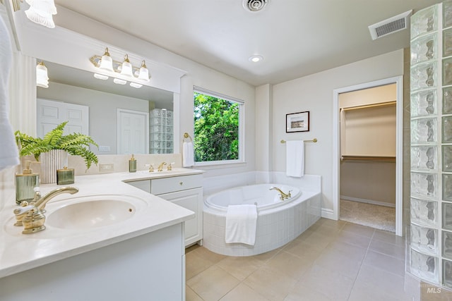 2383 E Lenox Ct, Eagle, ID 83616 - bathroom with double vanity, a bath, tile patterned floors, and a spacious closet
