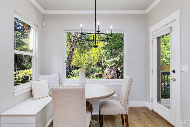 2383 E Lenox Ct, Eagle, ID 83616 - dining room with a chandelier, light wood-style floors, crown molding, and baseboards