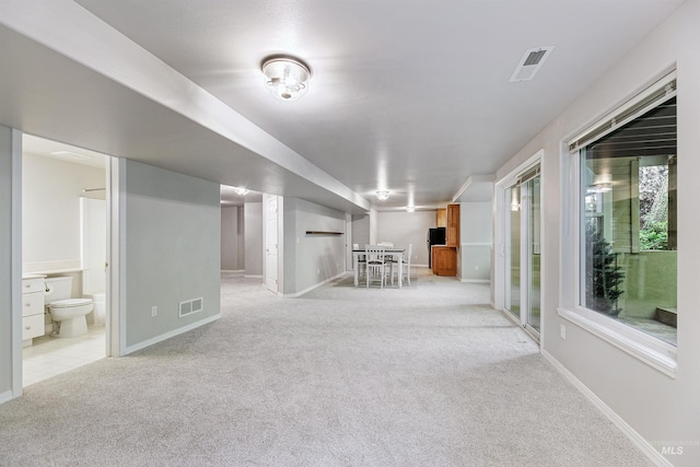 2383 E Lenox Ct, Eagle, ID 83616 - below grade area featuring light carpet, baseboards, and bar area