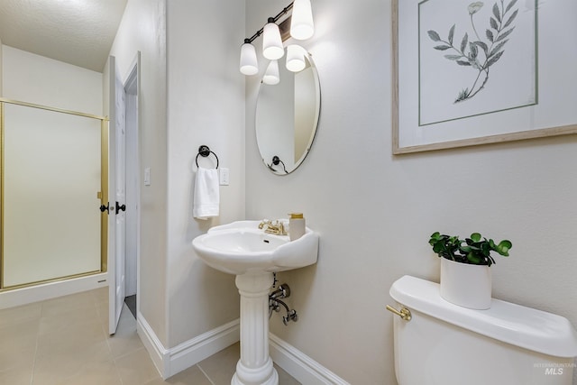 2383 E Lenox Ct, Eagle, ID 83616 - bathroom with toilet, tile patterned floors, and baseboards