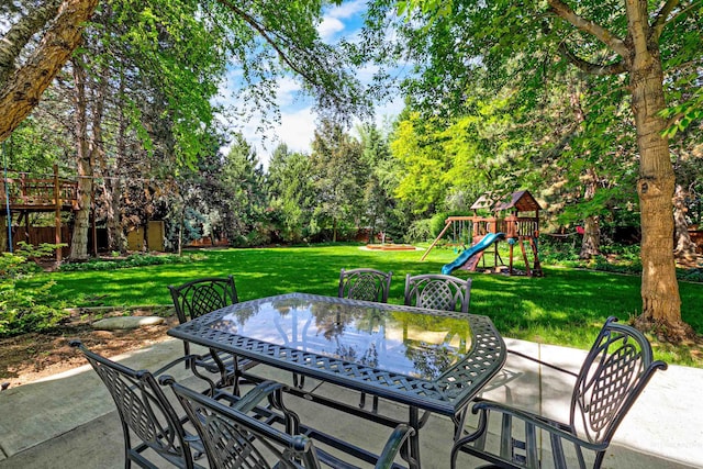 2383 E Lenox Ct, Eagle, ID 83616 - view of patio / terrace featuring a playground, outdoor dining area, and view of wooded area