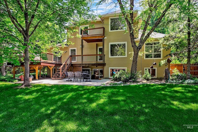 2383 E Lenox Ct, Eagle, ID 83616 - back of property with a balcony, a patio, and stairs