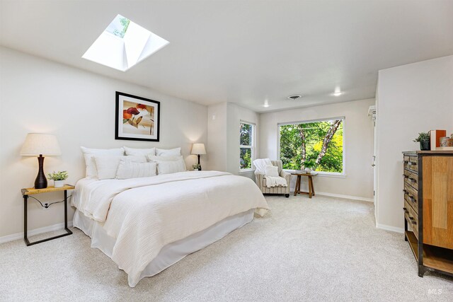 2383 E Lenox Ct, Eagle, ID 83616 - bedroom featuring a skylight, baseboards, and light colored carpet