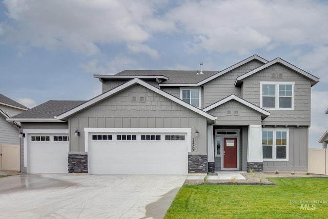 craftsman-style home with a garage and a front yard