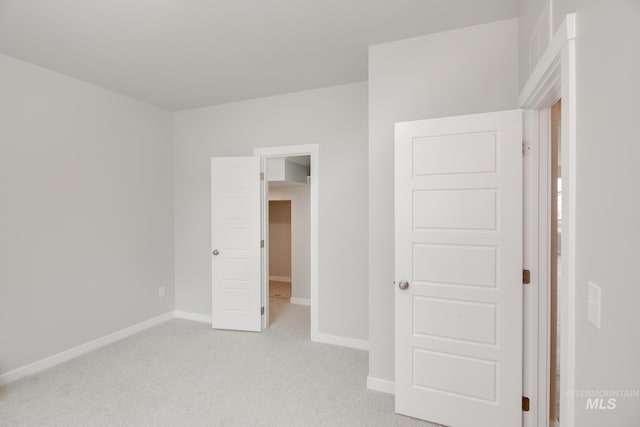 unfurnished bedroom with light colored carpet