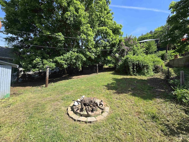 628 Main St, Orofino, ID 83544 - view of green lawn featuring a fire pit