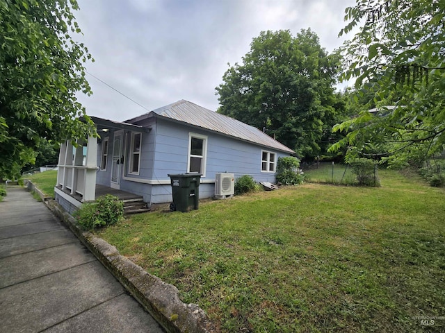 628 Main St, Orofino, ID 83544 - view of home's exterior with a cooling unit and metal roof