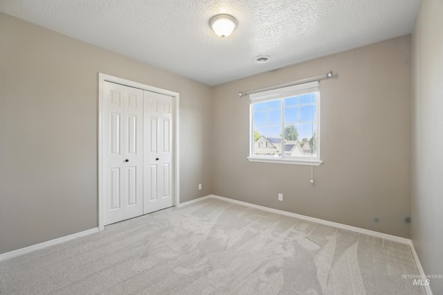 841 Shire St, Middleton, ID 83644 - unfurnished bedroom with carpet floors, a closet, a textured ceiling, and baseboards