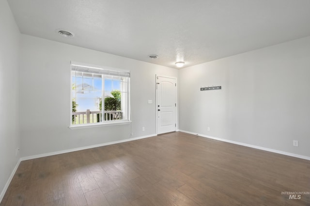 841 Shire St, Middleton, ID 83644 - empty room featuring dark wood-style flooring and baseboards