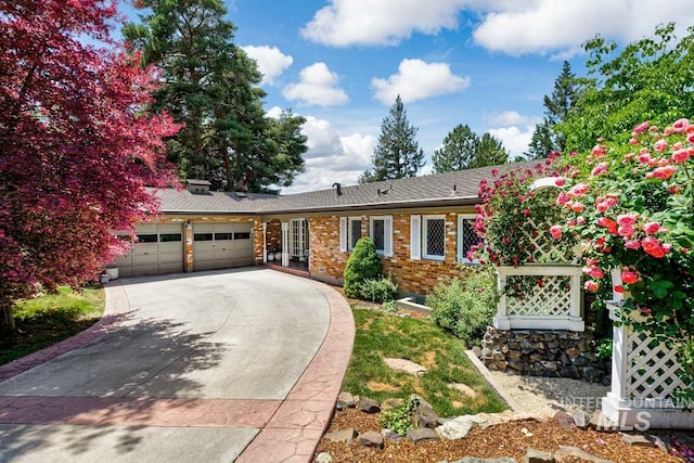 928 N Argyll Dr, Boise, ID 83702 - ranch-style home with a garage, concrete driveway, and brick siding