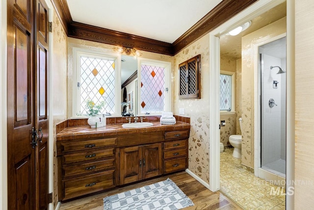 928 N Argyll Dr, Boise, ID 83702 - full bathroom featuring toilet, vanity, wood finished floors, crown molding, and a shower stall