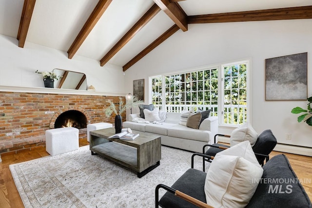 928 N Argyll Dr, Boise, ID 83702 - living room with wood finished floors, beam ceiling, high vaulted ceiling, a fireplace, and a baseboard heating unit