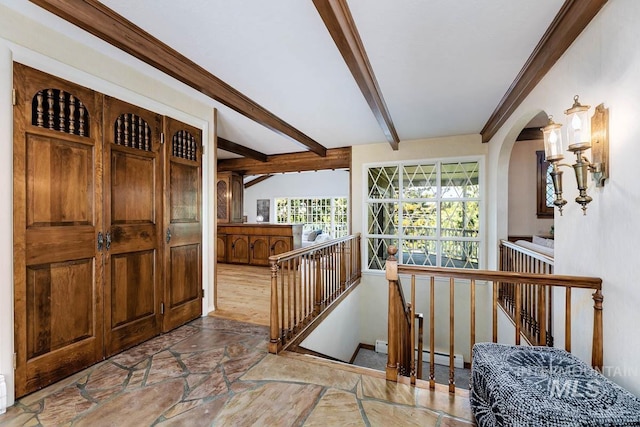 928 N Argyll Dr, Boise, ID 83702 - entryway featuring stone tile floors, beamed ceiling, arched walkways, and baseboard heating