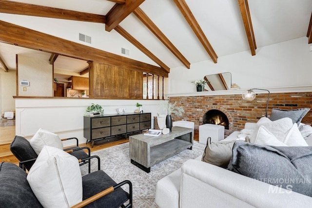 928 N Argyll Dr, Boise, ID 83702 - living room featuring wood finished floors and a brick fireplace