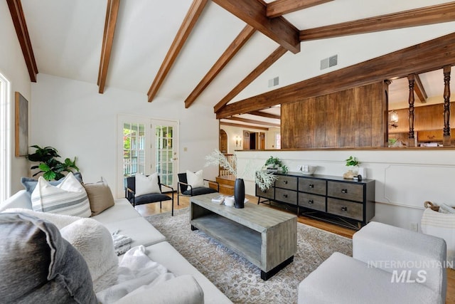 928 N Argyll Dr, Boise, ID 83702 - living area featuring wood finished floors, beamed ceiling, and high vaulted ceiling