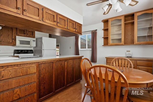 371 Dubois, Twin Falls, ID 83301 - kitchen featuring open shelves, white appliances, light wood-style floors, light countertops, and a ceiling fan