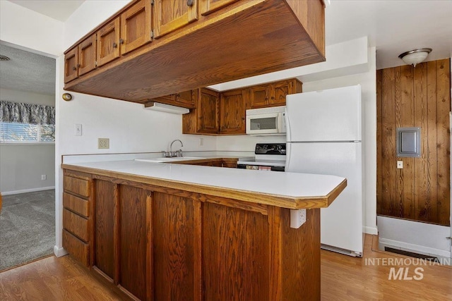 371 Dubois, Twin Falls, ID 83301 - kitchen with white appliances, a peninsula, wood finished floors, and light countertops