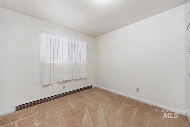 371 Dubois, Twin Falls, ID 83301 - unfurnished room featuring carpet floors, baseboards, and a baseboard radiator