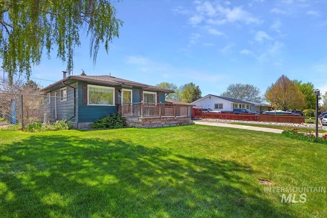 371 Dubois, Twin Falls, ID 83301 - rear view of house with a lawn, fence, a chimney, and a deck
