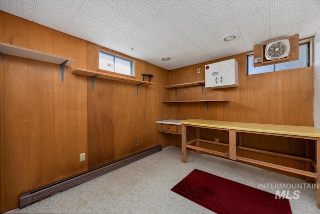 371 Dubois, Twin Falls, ID 83301 - basement with a baseboard radiator, wooden walls, and carpet flooring