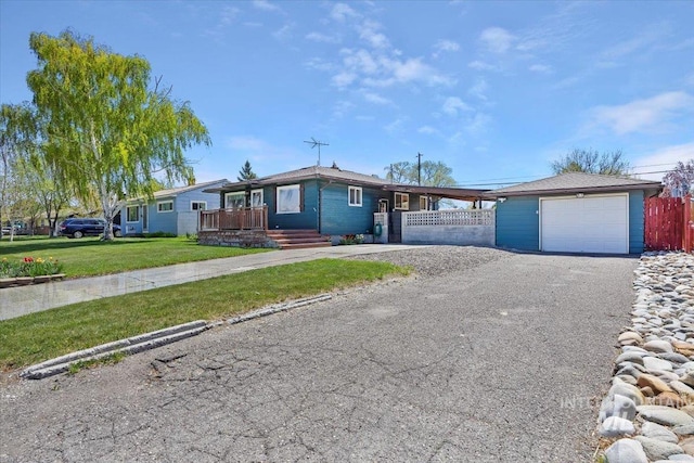 371 Dubois, Twin Falls, ID 83301 - ranch-style home featuring a garage, a front lawn, fence, covered porch, and driveway