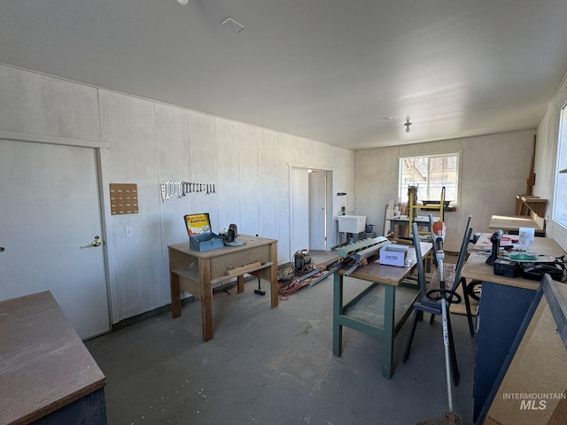 office space with concrete flooring