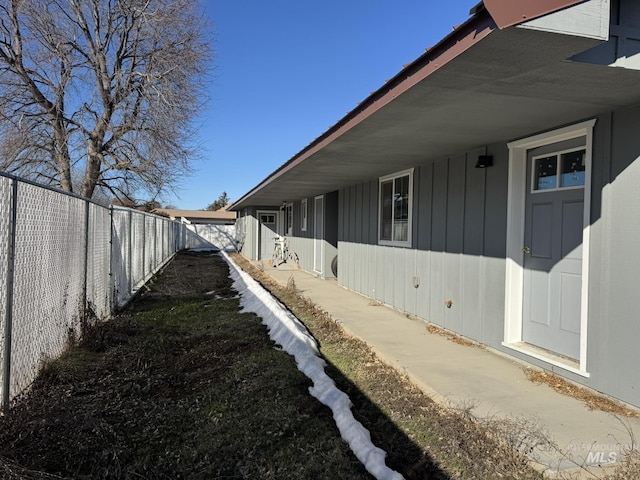 view of side of property featuring a fenced backyard