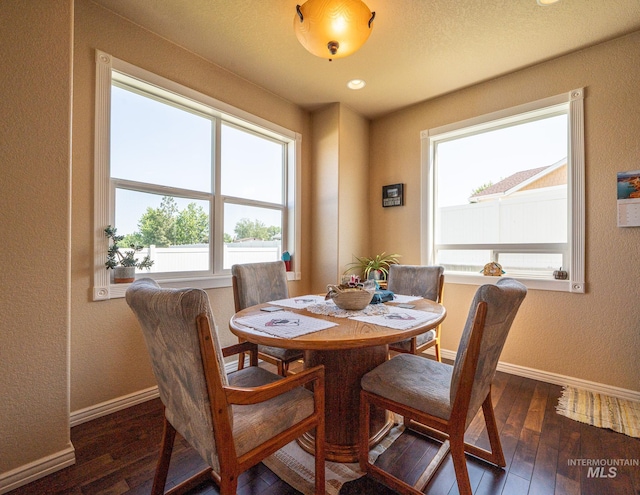 201 E S 10th St, Grangeville, ID 83530 - dining space with baseboards, dark wood-style floors, a textured wall, and recessed lighting
