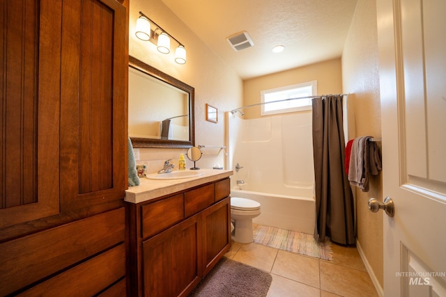 201 E S 10th St, Grangeville, ID 83530 - full bath with toilet, vanity, shower / bath combo with shower curtain, tile patterned floors, and a textured ceiling