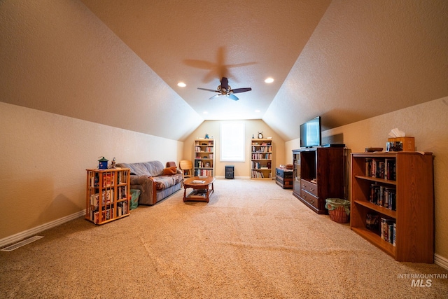 201 E S 10th St, Grangeville, ID 83530 - living area featuring carpet, vaulted ceiling, ceiling fan, a textured ceiling, and baseboards