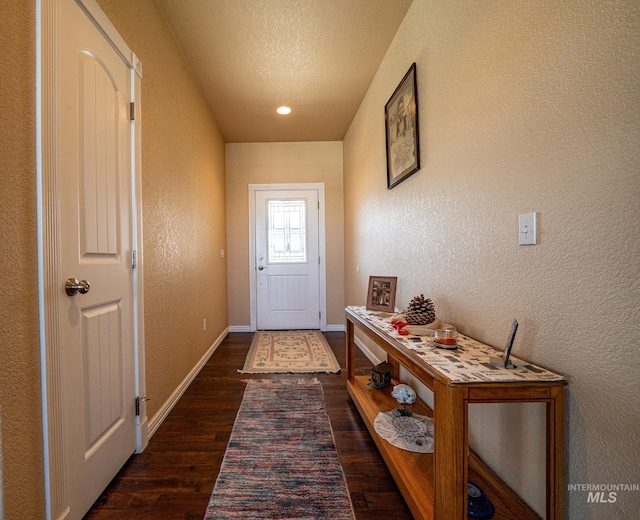 201 E S 10th St, Grangeville, ID 83530 - doorway featuring dark wood-style flooring, a textured wall, baseboards, and a textured ceiling